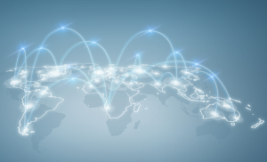 Glowing blue digital world map showing global network nodes to illustrate business internet latency causes.