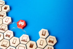 Wooden blocks with network icons connecting to block a malware threat through open source firewall integration
