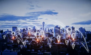 Illuminated city skyline with glowing network nodes representing agnostic last-mile connectivity