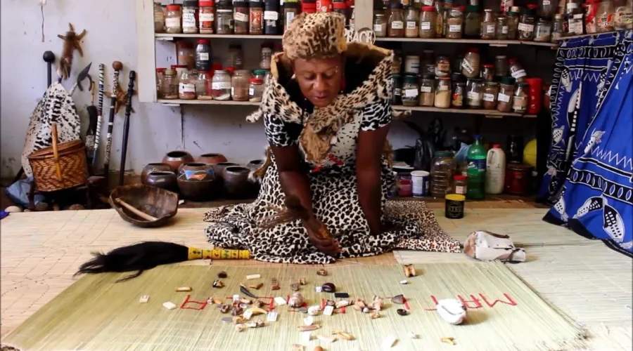 Traditional healer throwing bones on a mat, representing the gamble of guessing internet circuit failures without failover.