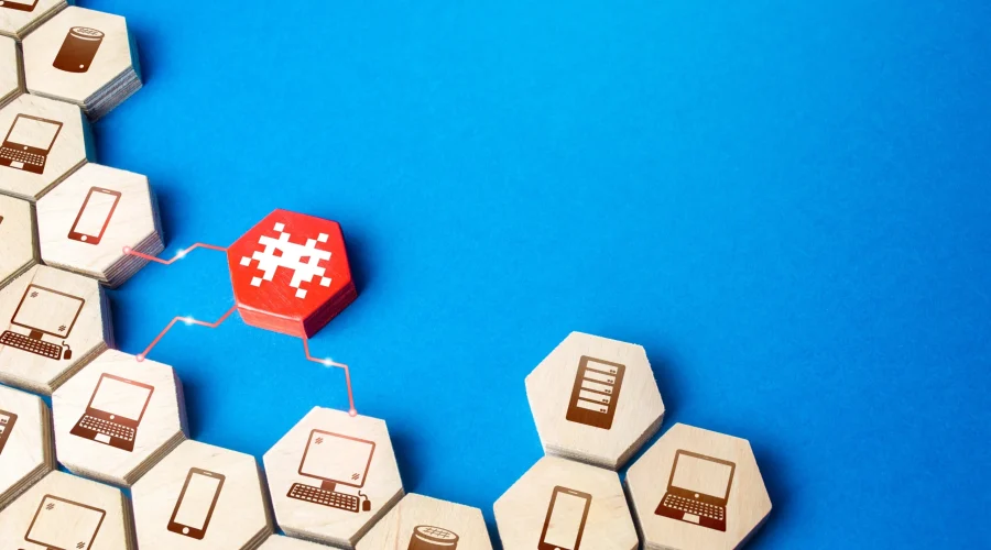 Wooden blocks with network icons connecting to block a malware threat through open source firewall integration