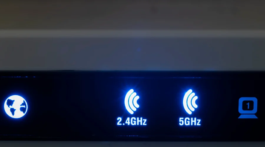 Router interface showing glowing 2.4GHz and 5GHz indicator lights for reliable enterprise Wi-Fi hotspots.