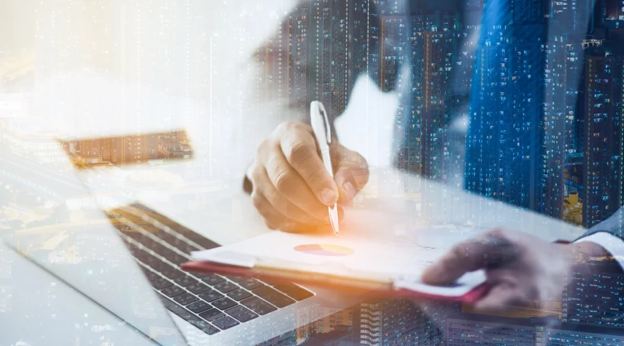 Close up of a professional analyzing financial data on a laptop secured by SD-WAN for accounting firms.