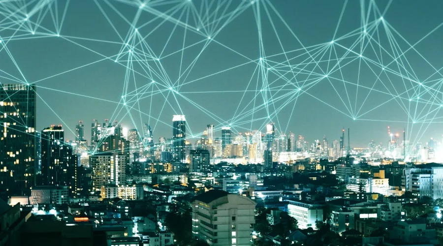Nighttime cityscape covered by a glowing green digital mesh highlighting SD-WAN deployment failure