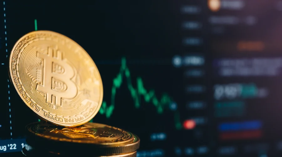 Bitcoin resting on stacked coins against a digital trading chart, secured by SD-WAN for financial services.