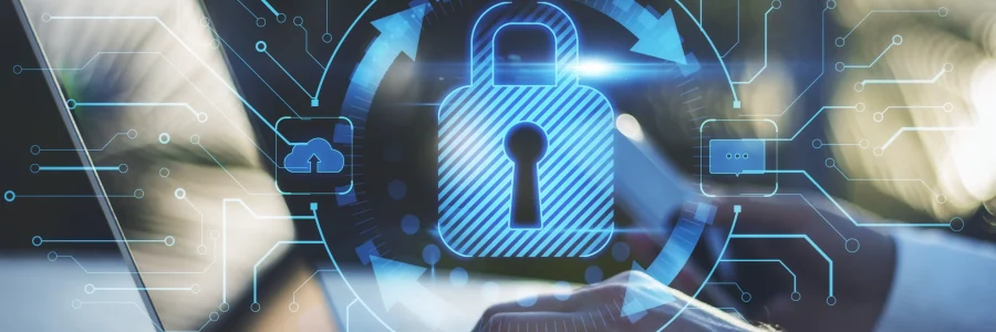 Professional typing on a laptop protected by a glowing digital padlock and vendor-agnostic cybersecurity